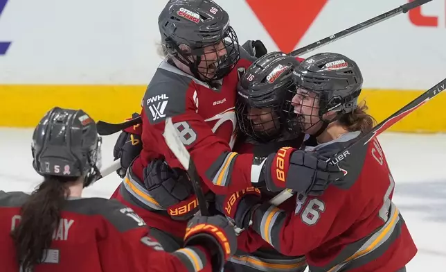 Ottawa Charge's Ronja Savolainen (88) celebrates with teammates after her goal against the Boston Fleet during third-period PWHL hockey playoff action in Ottawa, Ontario, Friday, May 8, 2026. (Adrian Wyld/The Canadian Press via AP)