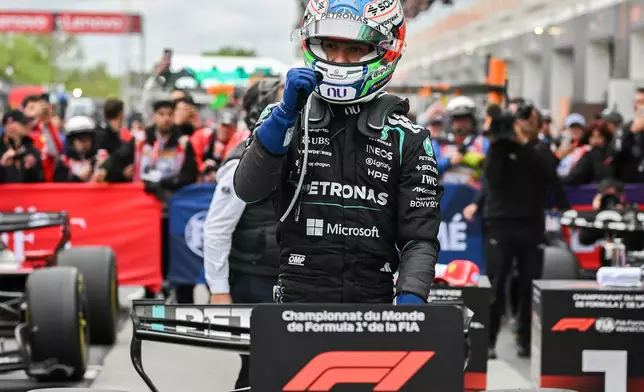 Mercedes driver Kimi Antonelli, of Italy, celebrates after winning the F1 Canadian Grand Prix auto race in Montreal, Sunday, May 24, 2026. (Graham Hughes/The Canadian Press via AP)