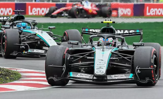 Mercedes driver Kimi Antonelli, front, of Italy, leads teammate George Russell, of Britain, during the F1 Canadian Grand Prix auto race in Montreal, Sunday, May 24, 2026. (Graham Hughes/The Canadian Press via AP)