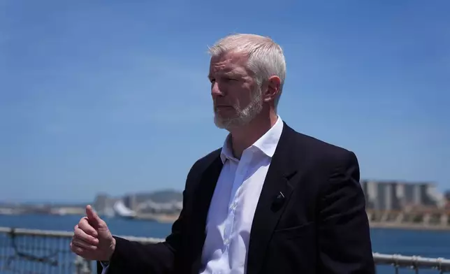 Britain's Armed Forces Minister Al Carns speaks during an interview on RFA Lyme Bay, in territory of Gibraltar, on Friday, May 22, 2026. (AP Photo/Kwiyeon Ha)