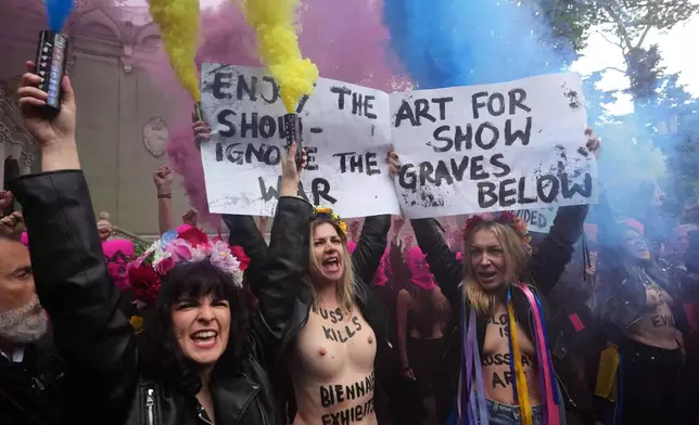 EDS NOTE: NUDITY - Pussy Riot and FEMEN activists stage a protest against Russia's presence after its absence following its 2022 invasion of Ukraine in front of the Russian pavilion, at the 2026 Art Venice Biennale, in Venice, Italy, Wednesday, May 6, 2026. (AP Photo/Luca Bruno)
