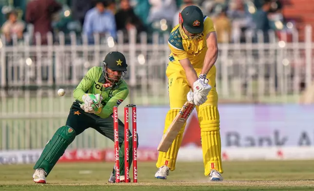 Australia's Cameron Green, right, is bowled by Pakistan's Arafat Minhas during the first One Day International cricket match between Pakistan and Australia, in Rawalpindi, Pakistan, Saturday, May 30, 2026. (AP Photo/Anjum Naveed)