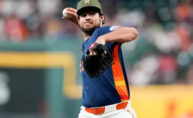 Houston Astros starting pitcher Peter Lambert throws against the Texas Rangers during the first inning of a baseball game, Sunday, May 17, 2026, in Houston. (AP Photo/Eric Christian Smith)