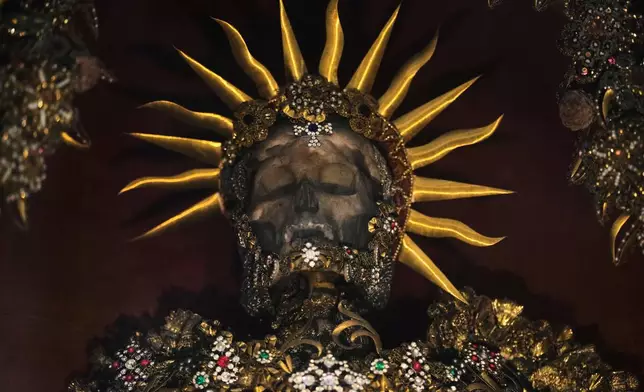 An elaborately decorated skeleton lies in the catholic monastery church of Banz in Bad Staffelstein, Germany, Saturday, May 2, 2026. (AP Photo/Matthias Schrader)