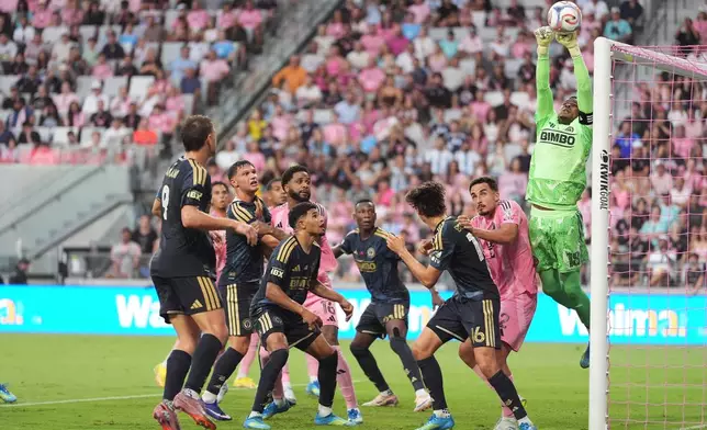 Philadelphia Union goalkeeper Andre Blake (18) deflects a corner kick from Inter Miami forward Lionel Messi during the first half of an MLS soccer match, Sunday, May 24, 2026, in Miami. (AP Photo/Rebecca Blackwell)