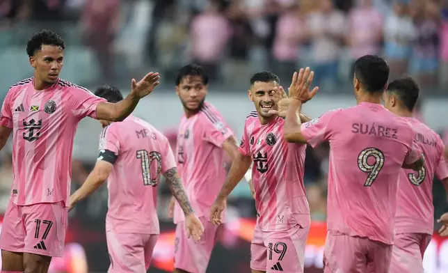Inter Miami forward Germán Berterame (19) celebrates with teammates after scoring his side's third goal during the first half of an MLS soccer match against Philadelphia Union, Sunday, May 24, 2026, in Miami. (AP Photo/Rebecca Blackwell)