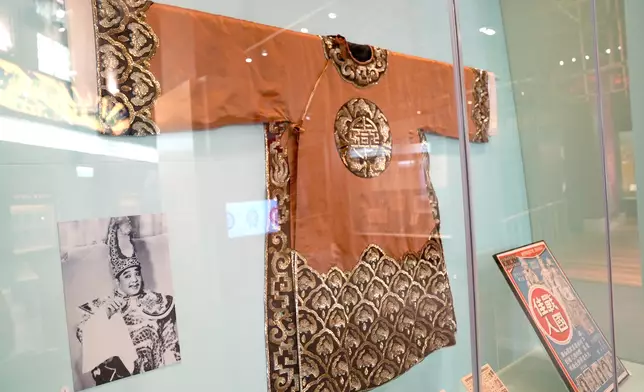 The brown man's python ceremonial robe with gold and silver sequins worn by Leung Sing Por in the 1950s, Photo by Bastille Post
