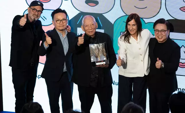 The Cultural and Creative Industries Development Agency under the Culture, Sports and Tourism Bureau, and the Hong Kong Film Development Council (FDC) led an industry delegation to participate in the 28th Far East Film Festival (FEFF) in Udine, Italy, held from April 24 to May 2 (Udine time). The delegation witnessed Hong Kong's veteran director and acclaimed action choreographer Yuen Woo-ping receiving the FEFF's Golden Mulberry Award for Lifetime Achievement. Photo shows Assistant Commissioner for Cultural and Creative Industries and the Secretary-General of the FDC, Mr Gary Mak (second left); the Chairman of the FDC, Dr Wilfred Wong (first right), and Yuen (centre), attending the closing ceremony of the FEFF in the evening on May 2 (Udine time). Source: HKSAR Government Press Releases