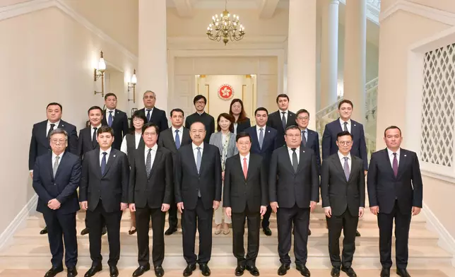 The Chief Executive, Mr John Lee (first row, fourth right), meets with the visiting Prime Minister of Uzbekistan, Mr Abdulla Nigmatovich Aripov (first row, fourth left), at Government House today (May 6). Source: HKSAR Government Press Releases