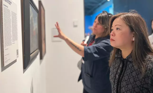 The Secretary for Culture, Sports and Tourism, Miss Rosanna Law, began her visit to Venice, Italy. Photo shows Miss Law (right) visiting a themed exhibition at the 61st International Art Exhibition - La Biennale di Venezia (Venice Biennale) and being briefed by a staff member on May 7 (Venice time). Source: HKSAR Government Press Releases