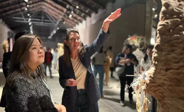 The Secretary for Culture, Sports and Tourism, Miss Rosanna Law, began her visit to Venice, Italy. Photo shows Miss Law (left) visiting the Italian Pavilion at the 61st International Art Exhibition - La Biennale di Venezia (Venice Biennale) and being briefed by a staff member on May 7 (Venice time) at the Arsenale. Source: HKSAR Government Press Releases