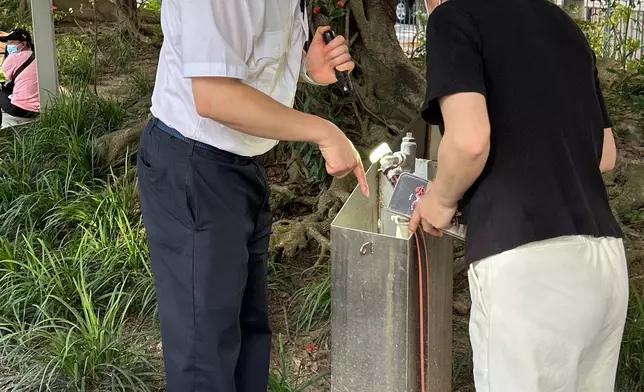 The Food and Environmental Hygiene Department (FEHD) today (May 14) released the second batch of gravidtrap indexes and density indexes for Aedes albopictus in May, covering 13 survey areas. Photo shows an FEHD staff member inspecting a park in Kennedy Town, Central and Western District. Following the discovery of stagnant water in the park, a statutory notice has been issued to the relevant venue management company, requiring the clearance of such item within a specified timeframe. Source: HKSAR Government Press Releases