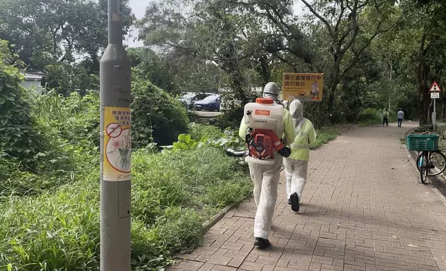 The Food and Environmental Hygiene Department (FEHD) today (May 14) released the second batch of gravidtrap indexes and density indexes for Aedes albopictus in May, covering 13 survey areas. Photo shows staff members of the FEHD's contractor conducting a fogging operation to eliminate adult mosquitoes in Fanling North, North District. Source: HKSAR Government Press Releases