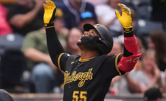 Pittsburgh Pirates' Esmerlyn Valdez celebrates as he crosses home plate after hitting a two-run home run off Chicago Cubs pitcher Jordan Wicks during the first inning of a baseball game in Pittsburgh, Tuesday, May 26, 2026. (AP Photo/Gene J. Puskar)