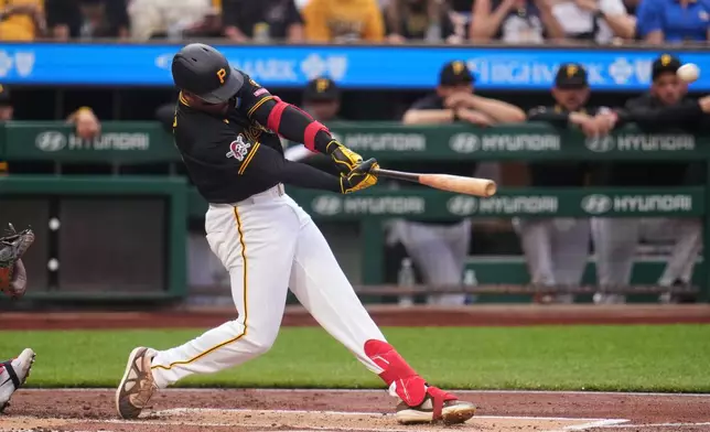 Pittsburgh Pirates' Esmerlyn Valdez hits a two-run home run off Chicago Cubs pitcher Jordan Wicks during the first inning of a baseball game in Pittsburgh, Tuesday, May 26, 2026. (AP Photo/Gene J. Puskar)