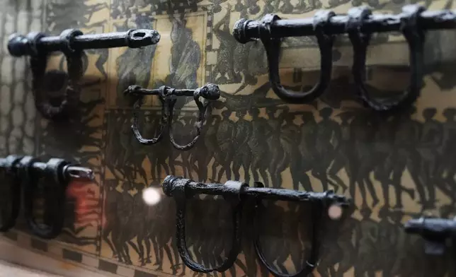 Ankle shackles, some child-sized, recovered from the wreck of the British slave ship Henrietta Marie, are displayed at the Mel Fisher Maritime Museum in Key West, Fla., Saturday, May 9, 2026. (AP Photo/Rebecca Blackwell)