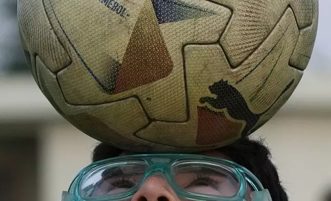 A boy practices at a Barcelona FC-sponsored soccer academy in Guayaquil, Ecuador, Thursday, May 14, 2026. (AP Photo/Dolores Ochoa)