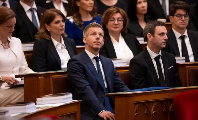 Hungarian Prime Minister-elect Peter Magyar gestures before the inauguration ceremony at the Parliament in Budapest, Hungary, Saturday, May 9, 2026. (AP Photo/Denes Erdos)