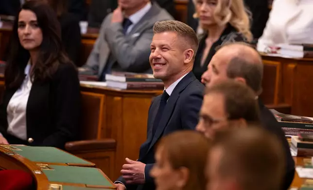Hungarian Prime Minister-elect Peter Magyar smiles before the inauguration ceremony at the Parliament in Budapest, Hungary, Saturday, May 9, 2026. (AP Photo/Denes Erdos)