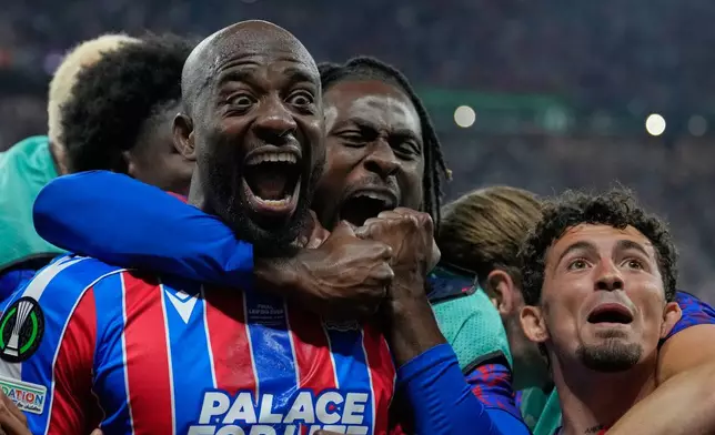 Crystal Palace's Jean-Philippe Mateta celebrates after scoring during the Europa Conference League final soccer match between Crystal Palace and Rayo Vallecano in Leipzig, Germany, Wednesday, May 27, 2026. (AP Photo/Ebrahim Noroozi)