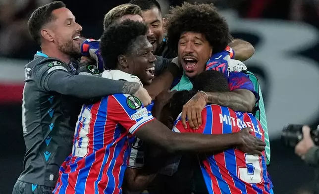 Crystal Palace players celebrate after the Europa Conference League final soccer match between Crystal Palace and Rayo Vallecano in Leipzig, Germany, Wednesday, May 27, 2026. (AP Photo/Ebrahim Noroozi)