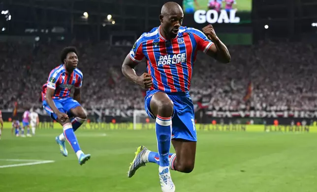 Crystal Palace's Jean-Philippe Mateta celebrates after scoring during the Europa Conference League final soccer match between Crystal Palace and Rayo Vallecano in Leipzig, Germany, Wednesday, May 27, 2026. (Robert Michael/dpa via AP)