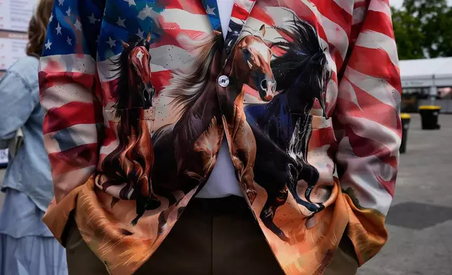 A race fan wears a colorful jacket before the 152nd running of the Kentucky Derby horse race at Churchill Downs, Saturday, May 2, 2026, in Louisville, Ky. (AP Photo/George Walker IV)