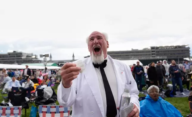 Bob Dean reacts after winning his bet on a race before the 152nd running of the Kentucky Derby horse race at Churchill Downs, Saturday, May 2, 2026, in Louisville, Ky. (AP Photo/George Walker IV)