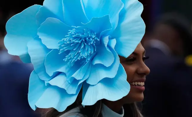 A woman wears a hat before the 152nd running of the Kentucky Derby horse race at Churchill Downs, Saturday, May 2, 2026, in Louisville, Ky. (AP Photo/Charlie Riedel)