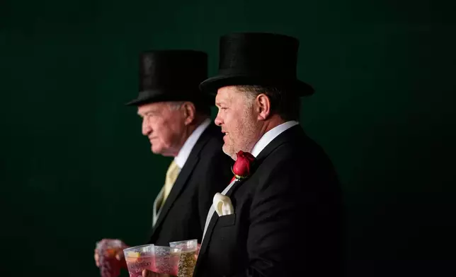 Fans head to the grandstand before the 152nd running of the Kentucky Derby horse race at Churchill Downs, Saturday, May 2, 2026, in Louisville, Ky. (AP Photo/Charlie Riedel)