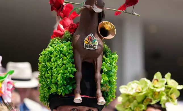 Garey Faulkner wears a hat before the 152nd running of the Kentucky Derby horse race at Churchill Downs, Saturday, May 2, 2026, in Louisville, Ky. (AP Photo/George Walker IV)