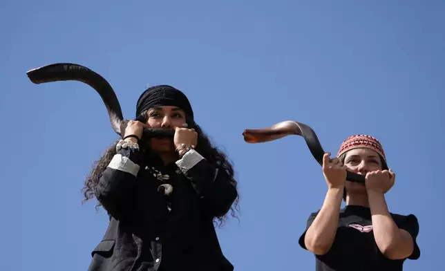 Musicians play kudu horns during a performance dubbed "Sounds of the South," featuring music from southern Iran, at the Tehran Museum of Contemporary Art in Tehran, Iran, Thursday, May 21, 2026. (AP Photo/Vahid Salemi)