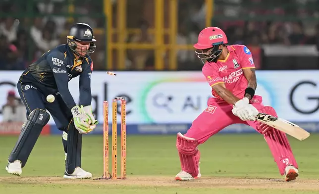 Rajasthan Royals' Dhruv Jurel bowled out by Gujarat Titans' Rashid Khan during the Indian Premier League cricket match between Rajasthan Royals and Gujarat Titans in Jaipur, India, Saturday, May 9, 2026. (AP Photo/ Str)