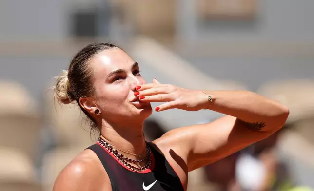 Aryna Sabalenka of Belarus celebrates after winning against Jessica Bouzas Maneiro of Spain during their first round women's singles tennis match at the French Open tennis tournament in Paris, Tuesday, May 26, 2026. (AP Photo/Christophe Ena)