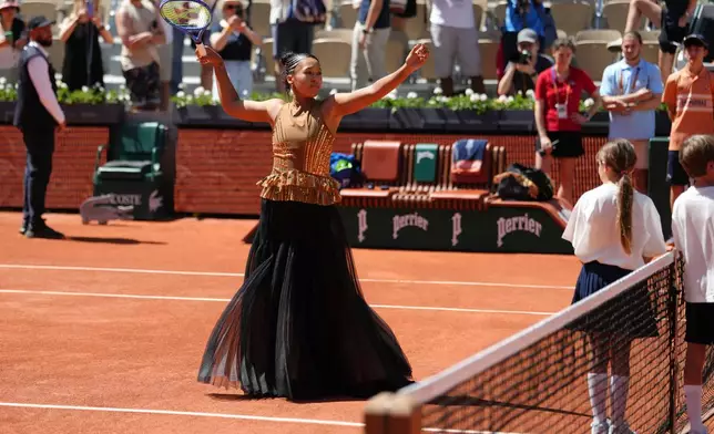 Naomi Osaka of Japan gestures before the first round women's singles tennis match against Laura Siegemund of Germany at the French Open tennis tournament in Paris, Tuesday, May 26, 2026. (AP Photo/Aurelien Morissard)