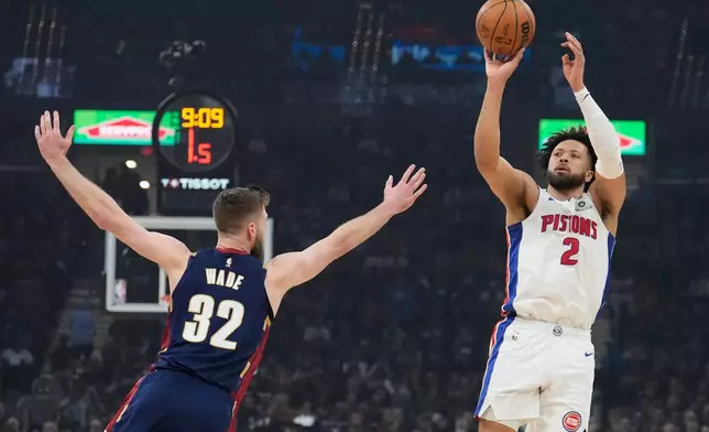 Detroit Pistons' Cade Cunningham (2) shoots over Cleveland Cavaliers' Dean Wade (32) in the first half of Game 6 of a second-round NBA basketball playoffs series Friday, May 15, 2026, in Cleveland. (AP Photo/Sue Ogrocki)
