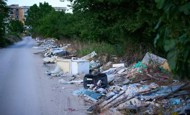 Illegal waste is seen on the side of a road in the outskirts of the southern Italian town of Acerra in the Terra dei Fuochi, or Land of Fires, an area scarred by decades of pollution from illegal waste dumping and burning, much of it linked to organized criminal groups, Friday, May 22, 2026, a day ahead of Pope Leo XIV's visit. (AP Photo/Andrew Medichini)