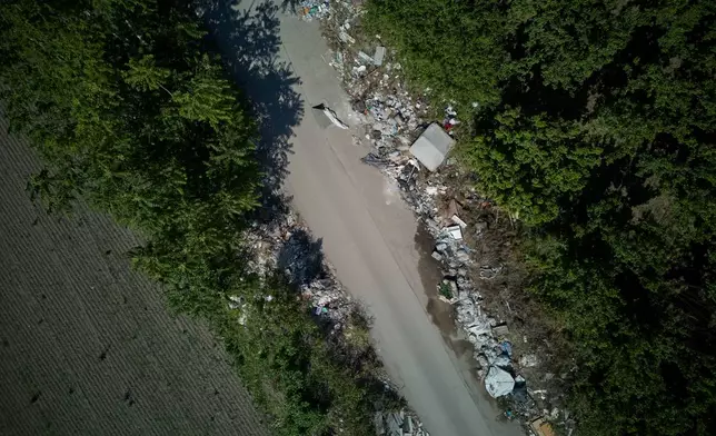 Illegal waste is seen on the side of a road in the outskirts of the southern Italian town of Acerra in the Terra dei Fuochi, or Land of Fires, an area scarred by decades of pollution from illegal waste dumping and burning, much of it linked to organized criminal groups, Friday, May 22, 2026, a day ahead of Pope Leo XIV's visit. (AP Photo/Andrew Medichini)
