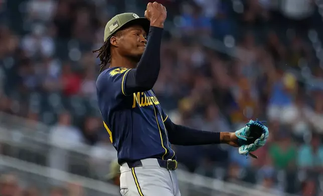 Milwaukee Brewers pitcher Abner Uribe celebrates after a double play to end the eighth inning of a baseball game against the Minnesota Twins, Friday, May 15, 2026, in Minneapolis. (AP Photo/Matt Krohn)