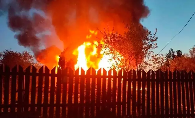 This photo released by Moscow Region Governor Andrei Vorobyev's official telegram channel shows a house on fire after a Ukrainian attack in Khimki, just outside Moscow, Russia, on Sunday, May 17, 2026. (Moscow Region Governor Andrei Vorobyev's official telegram channel via AP)