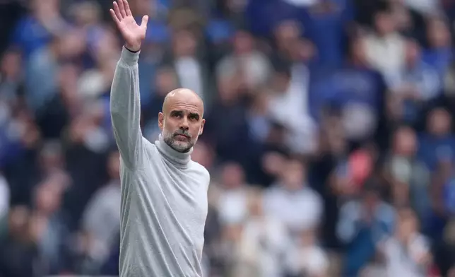 Manchester City's head coach Pep Guardiola greets fans before the English FA Cup final soccer match between Chelsea and Manchester City in London, Saturday, May 16, 2026. (AP Photo/Richard Pelham)
