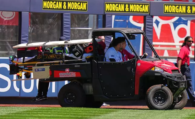 New York Yankees' Jasson Domínguez is carted off the field after an injury during the first inning of a baseball game against the Texas Rangers Thursday, May 7, 2026, in New York. (AP Photo/Frank Franklin II)