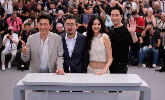 Hwang Jung-min, from left, director Na Hong-jin, Hoyeon and Zo In-sung pose for photographers at the photo call for the film 'Hope' during the 79th international film festival, Cannes, southern France, Monday, May 18, 2026. (AP Photo/John Locher)