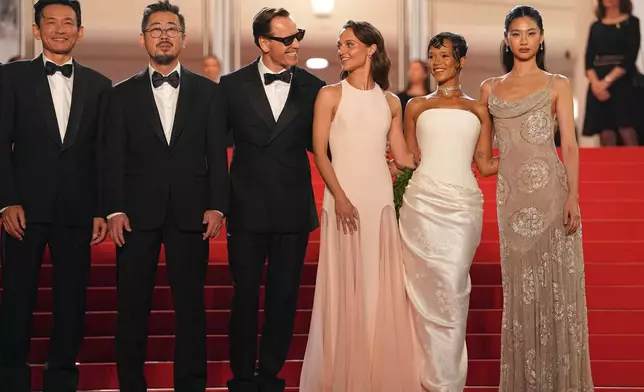 Hwang Jung-min, from left, director Na Hong-jin, Michael Fassbender, Alicia Vikander, Taylor Russell, and Hoyeon pose for photographers upon arrival at the premiere of the film 'Hope' at the 79th international film festival, Cannes, southern France, Sunday, May 17, 2026. (AP Photo/Andreea Alexandru)
