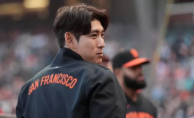 San Francisco Giants' Jung Hoo Lee stands in the dugout before a baseball game against the Chicago White Sox Friday, May 22, 2026, in San Francisco. (AP Photo/Jeff Chiu)