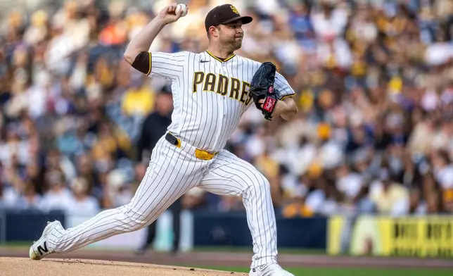 San Diego Padres starting pitcher Michael King throws to a Los Angeles Dodgers batter in the first inning of a baseball game, Monday, May 18, 2026, in San Diego. (AP Photo/Tony Ding)