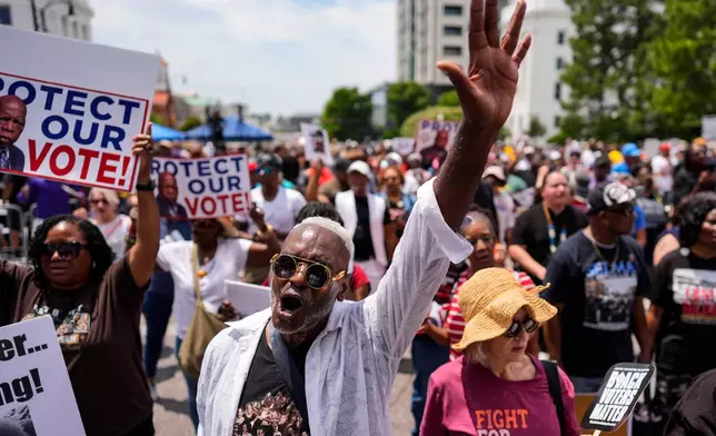 A man sings a spirtual song during a voting rally, Saturday, May 16, 2026, in Montgomery, Ala. (AP Photo/Mike Stewart)