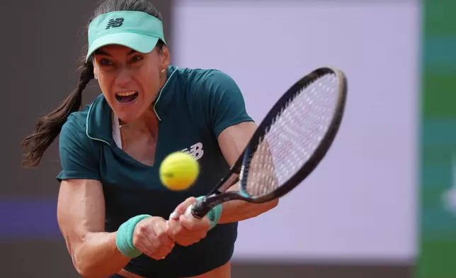 Romania's Sorana Cirstea returns to United States' Coco Gauff, during their match at the Italian Open tennis tournament in Rome, Thursday, May 14, 2026. (AP Photo/Andrew Medichini)