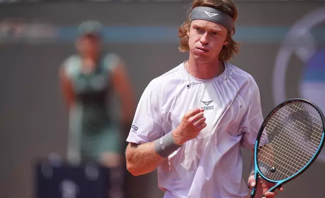 Andrey Rublev reacts as he plays Italy's Jannik Sinner during their match at the Italian Open tennis tournament in Rome, Thursday, May 14, 2026. (AP Photo/Andrew Medichini)