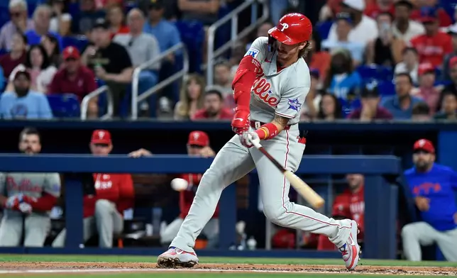 Philadelphia Phillies' Bryson Stott swings at the ball during the second inning of a baseball game against the Miami Marlins, Saturday, May 2, 2026, in Miami. (AP Photo/Michael Laughlin)